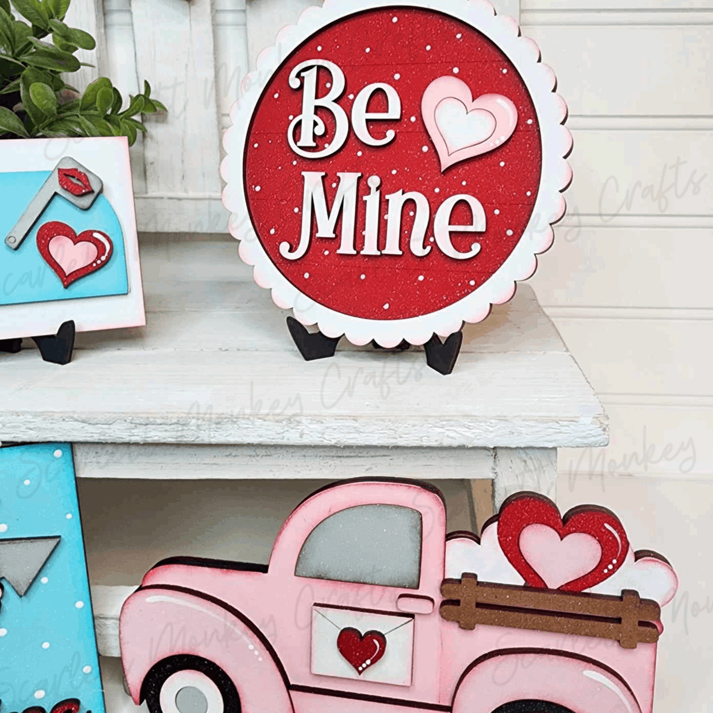 Paintable Wood Project Valentine Tiered Tray Set with heart-themed decorations.
