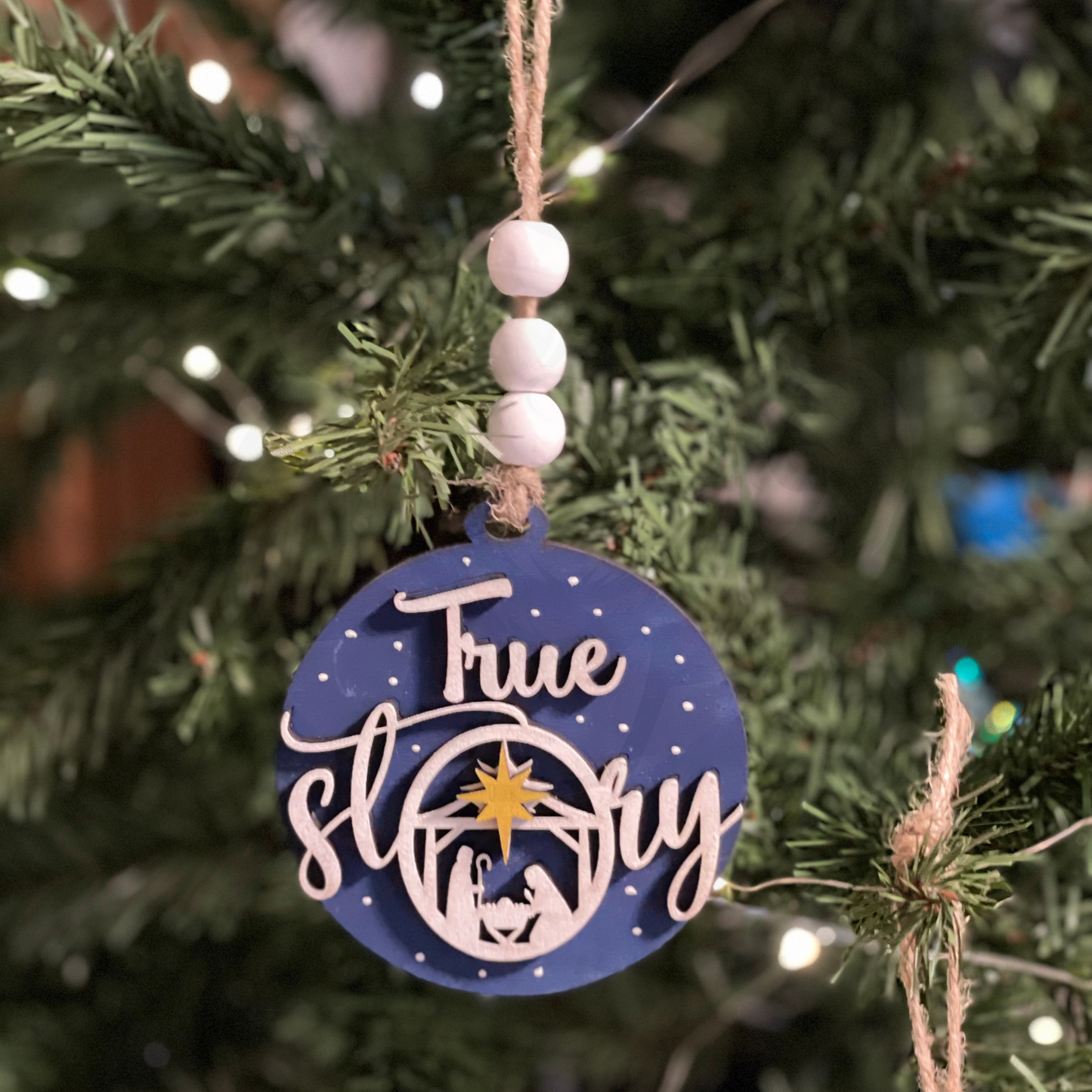 Handcrafted True Story Christmas Ornament on tree.