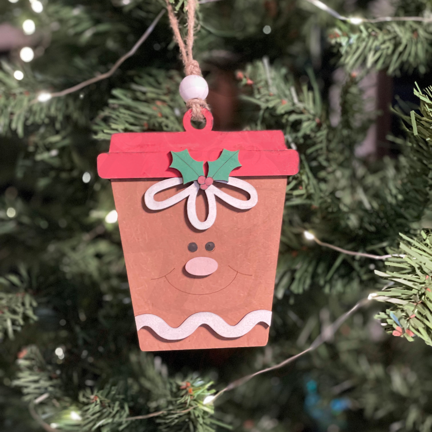 Hand-sculpted latte gingerbread Christmas ornament with money/gift card holder on tree.