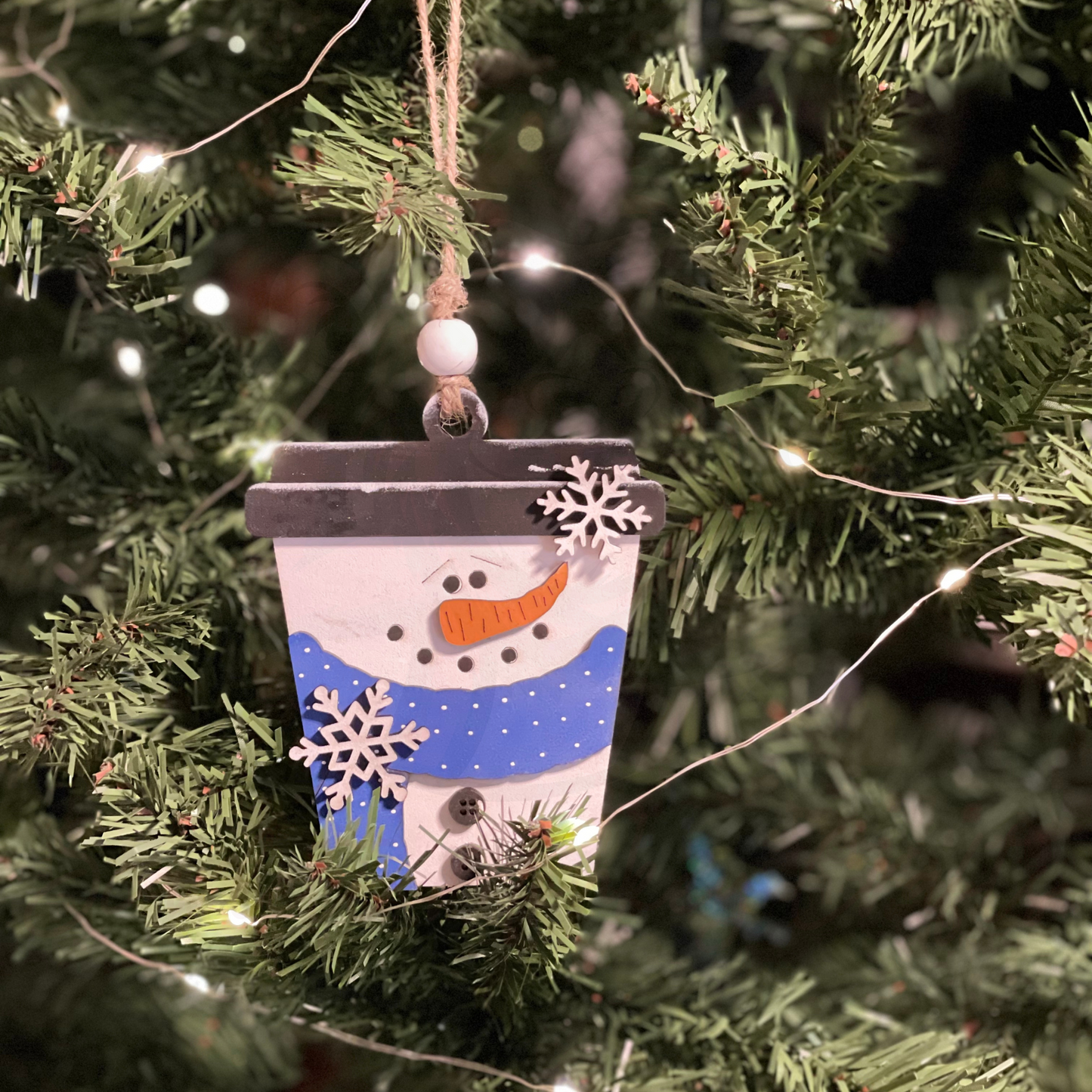 Christmas ornament latte snowman money gift card holder hanging on tree.