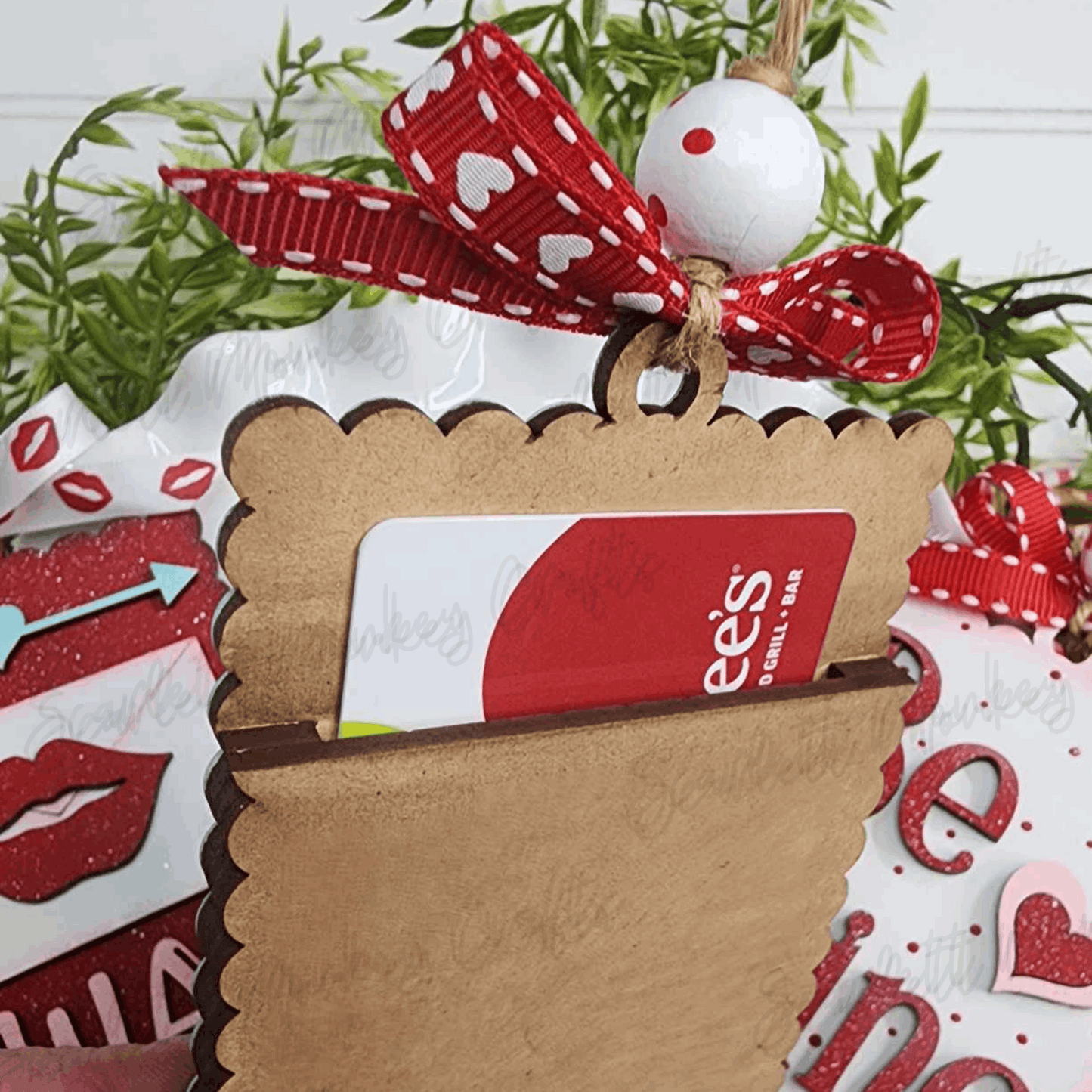 Paintable wood Valentine gift card tag with decorative ribbon and gift card insert slot.