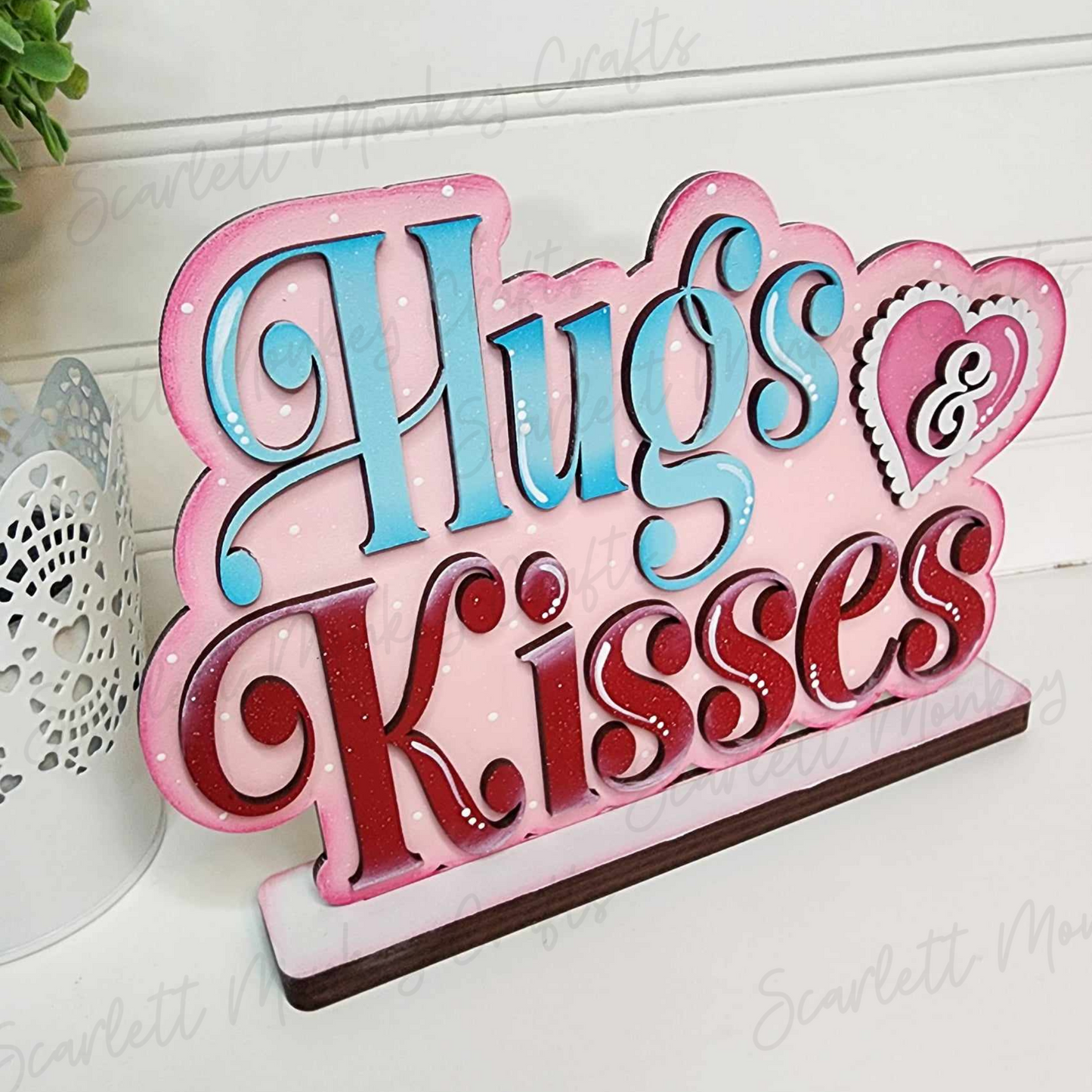 Valentine shelf sitter wood project with colorful 'Hugs & Kisses' design.