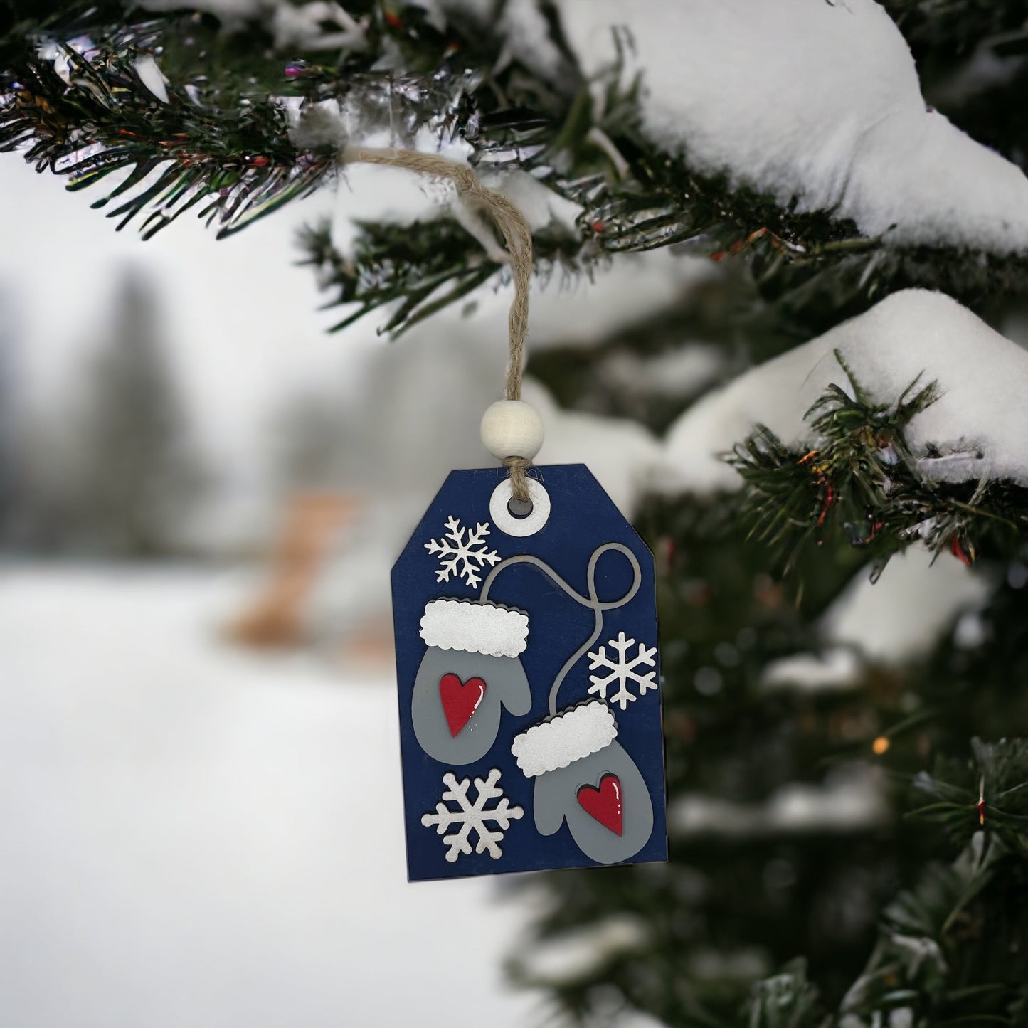 Christmas ornament featuring winter gloves design, hand-sculpted wood with money or gift card holder pocket.