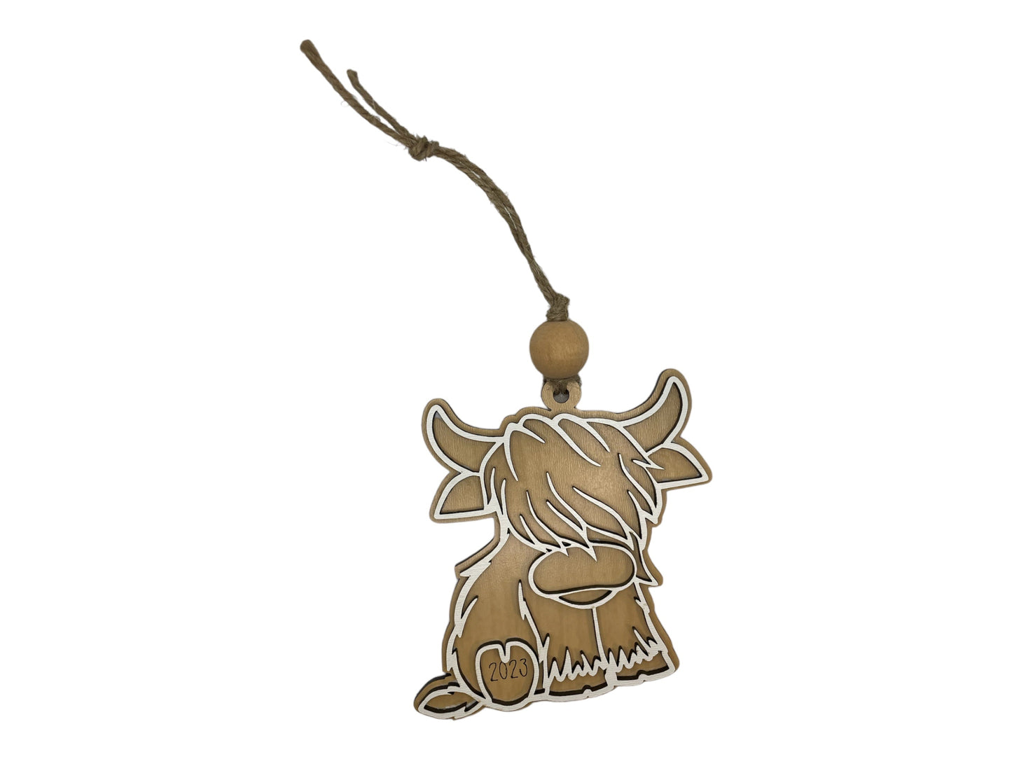 Christmas ornament featuring a cute Highland cow design.