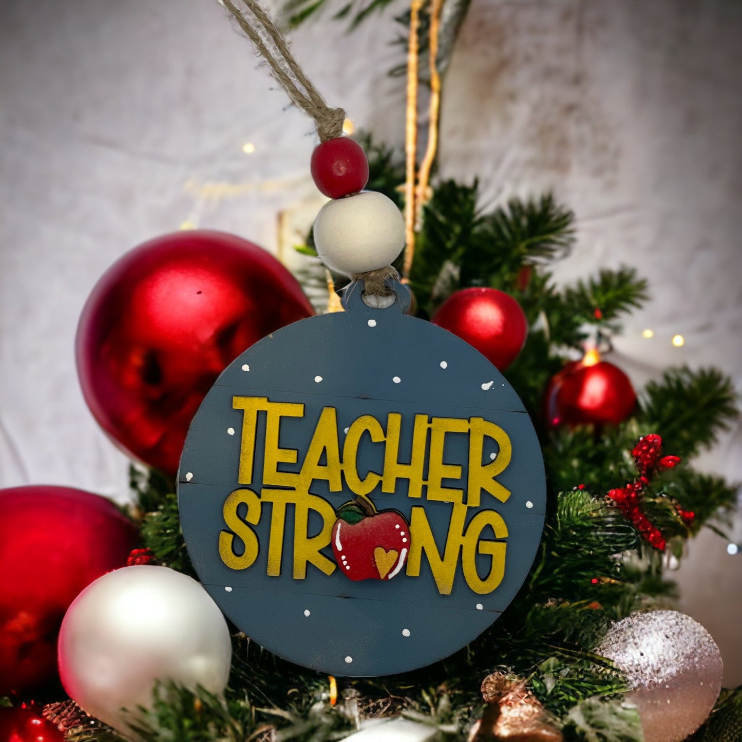 Handcrafted Christmas ornament with "Teacher Strong" design, ideal gift for teachers.