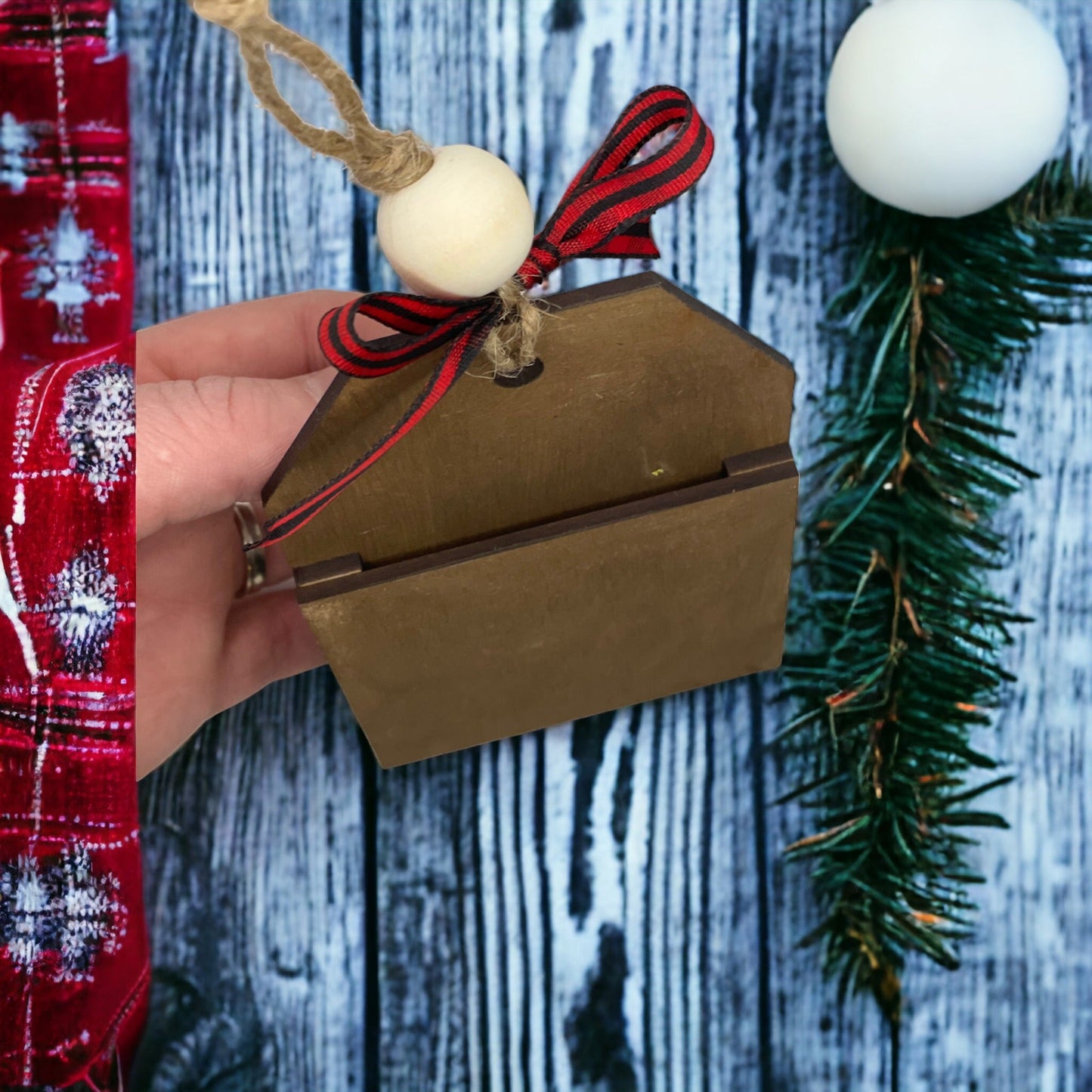 Elf-themed Christmas ornament with money or gift card holder pocket.
