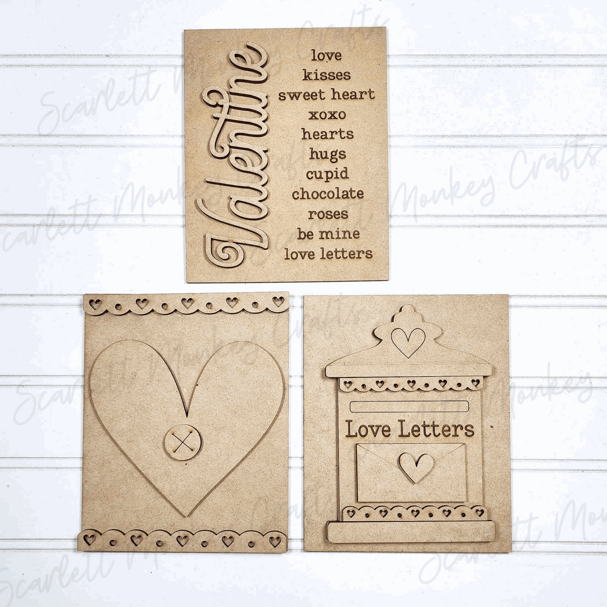Valentine's Day paintable wood project trio signs with heart and love letter designs.
