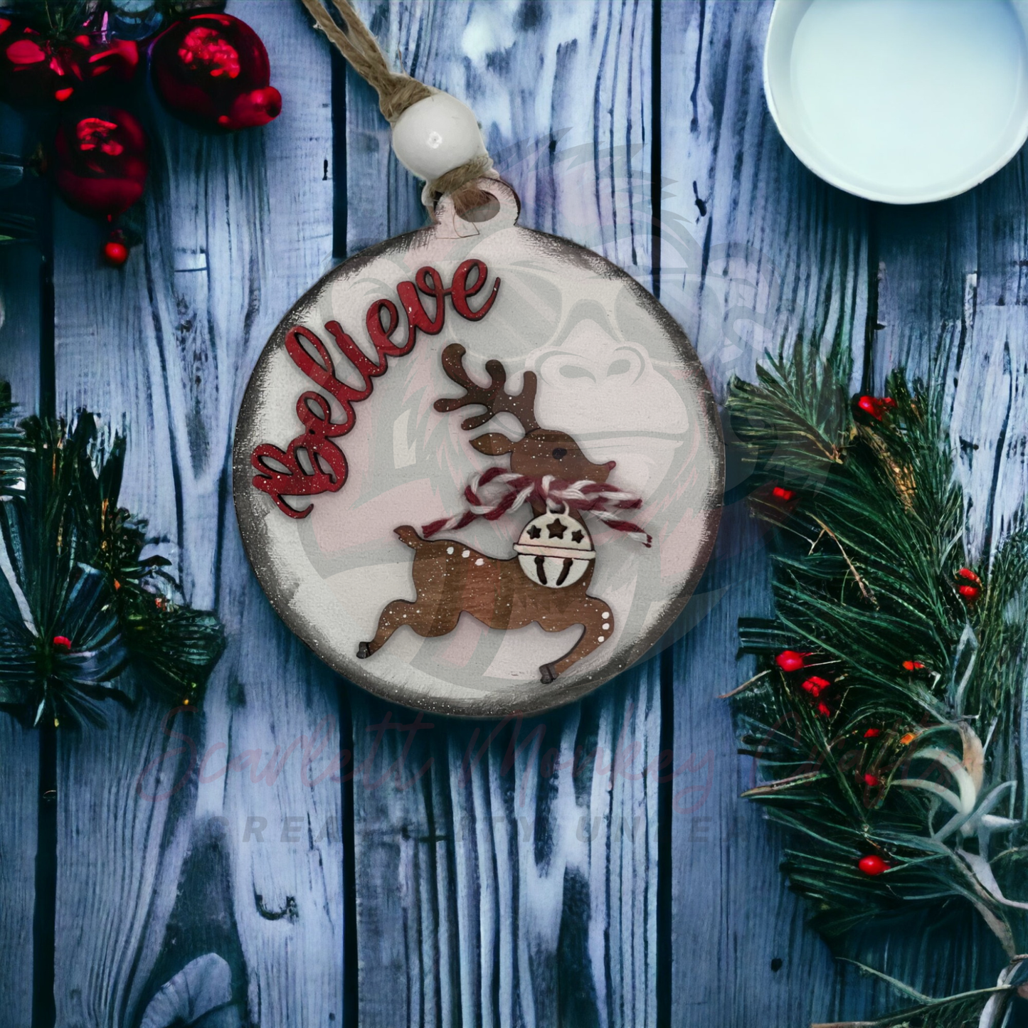 Hand-painted wooden Christmas ornament with reindeer and Believe lettering, natural twine hanger, festive holiday decor