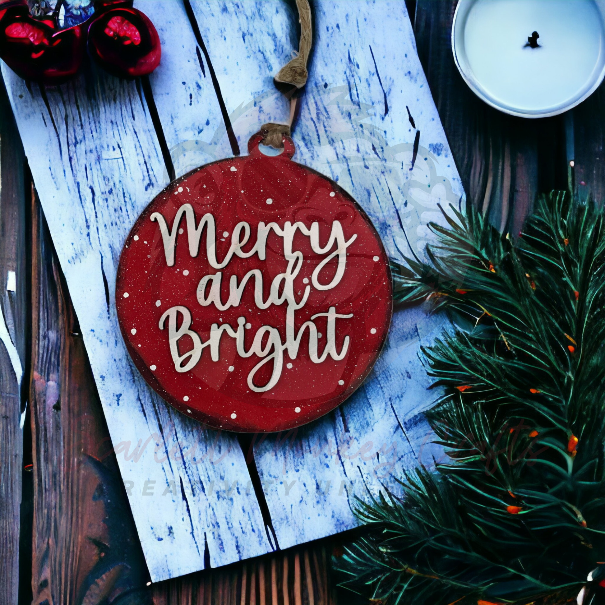 Hand-painted red wooden Christmas ornament with "Merry and Bright" lettering and natural twine hanger