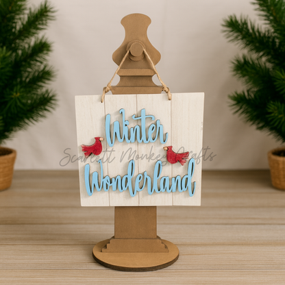 Hand-painted wooden winter theme wall hanger with "Winter Wonderland" text and red bird accents for Christmas decor