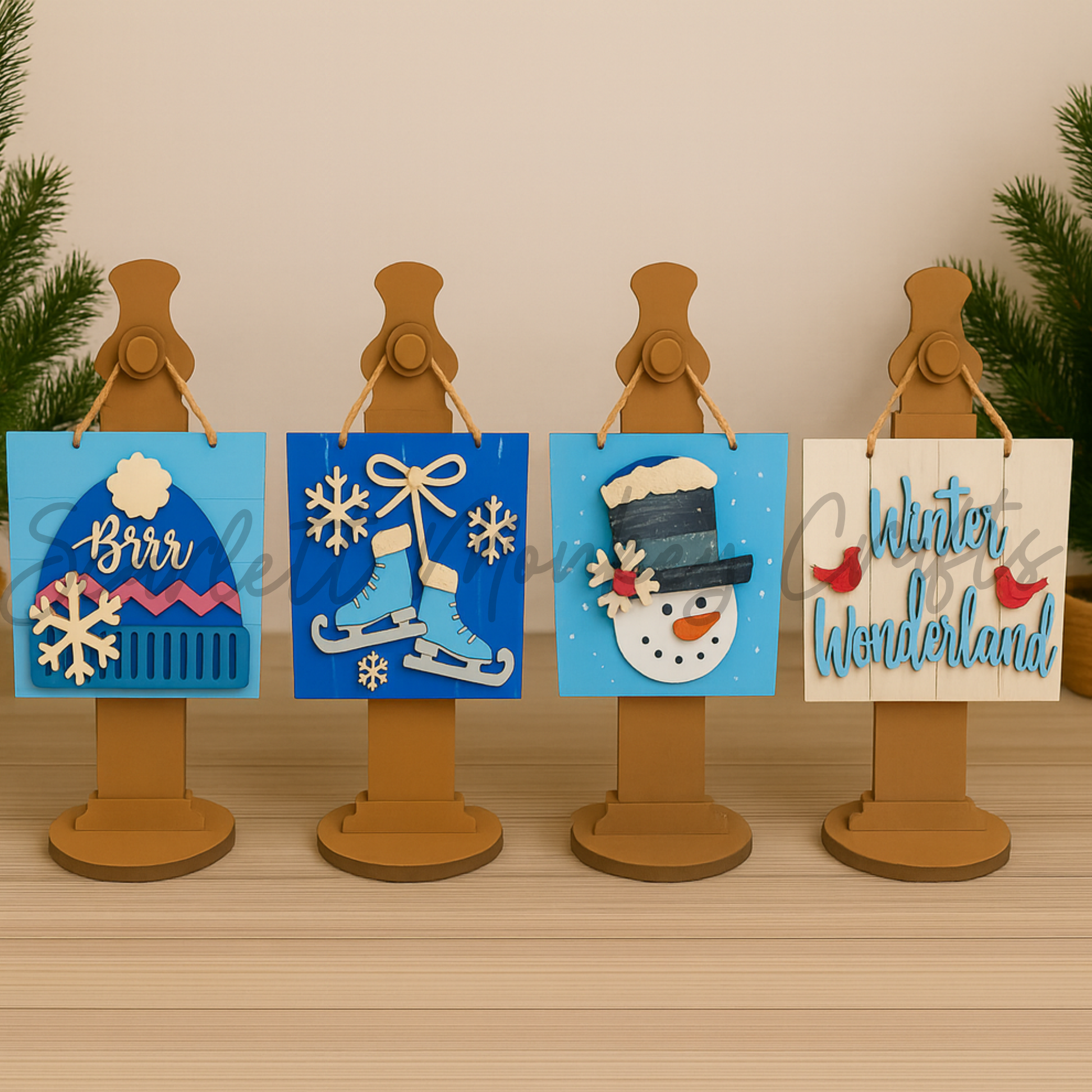 Set of hand-painted winter theme wall hangers with snowflake, ice skates, snowman, and "Winter Wonderland" designs for festive holiday decor