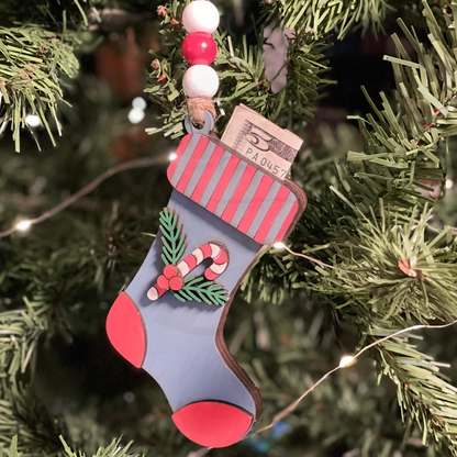 Christmas ornament blue stocking money gift card holder on tree.